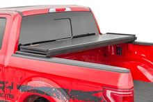 Load image into Gallery viewer, TOYOTA HARD TRI-FOLD BED COVER (16-19 TACOMA - 5&#39; BED W/CARGO MGMT)